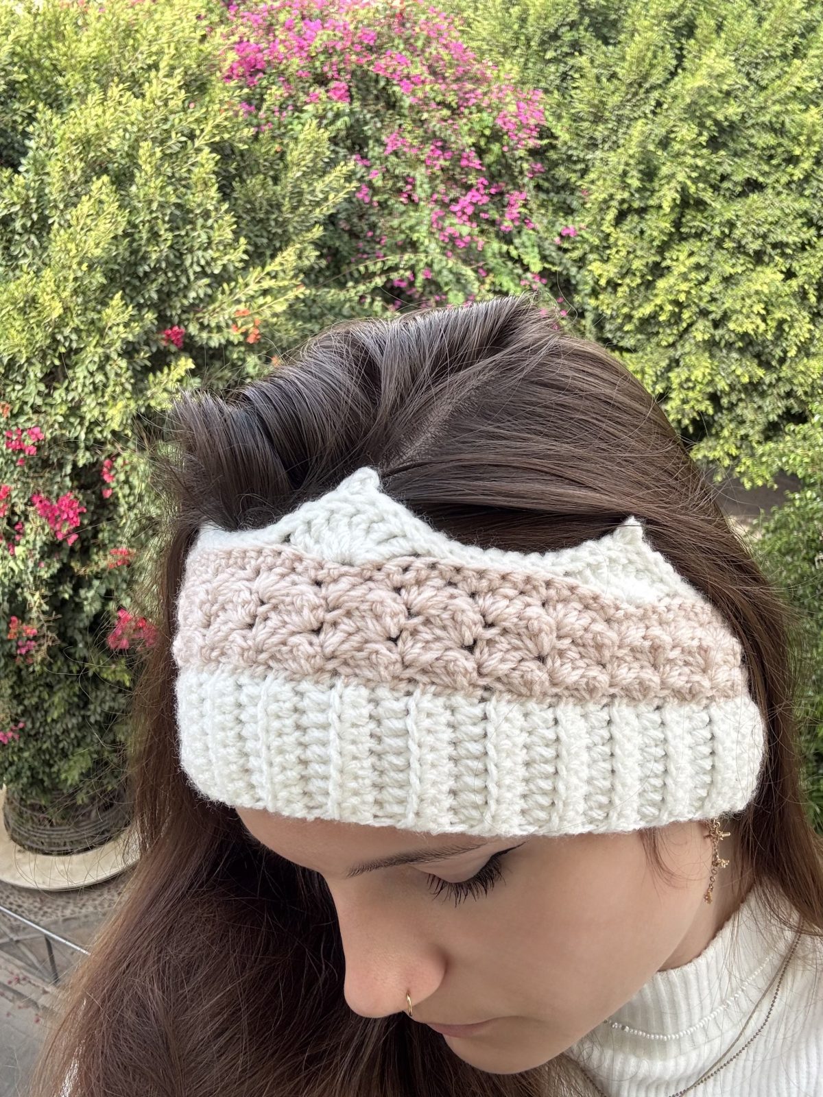 woman wearing white and pink crochet crown headband
